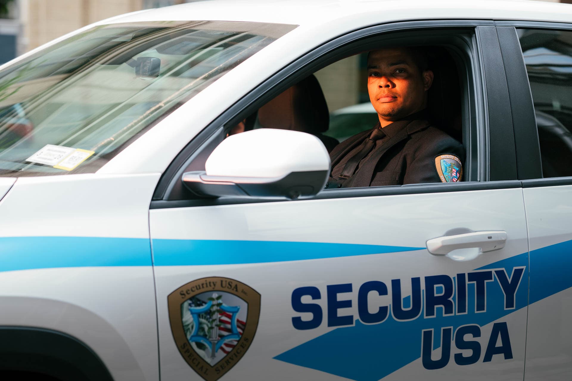 Image of Security USA® in company patrol vehicle.