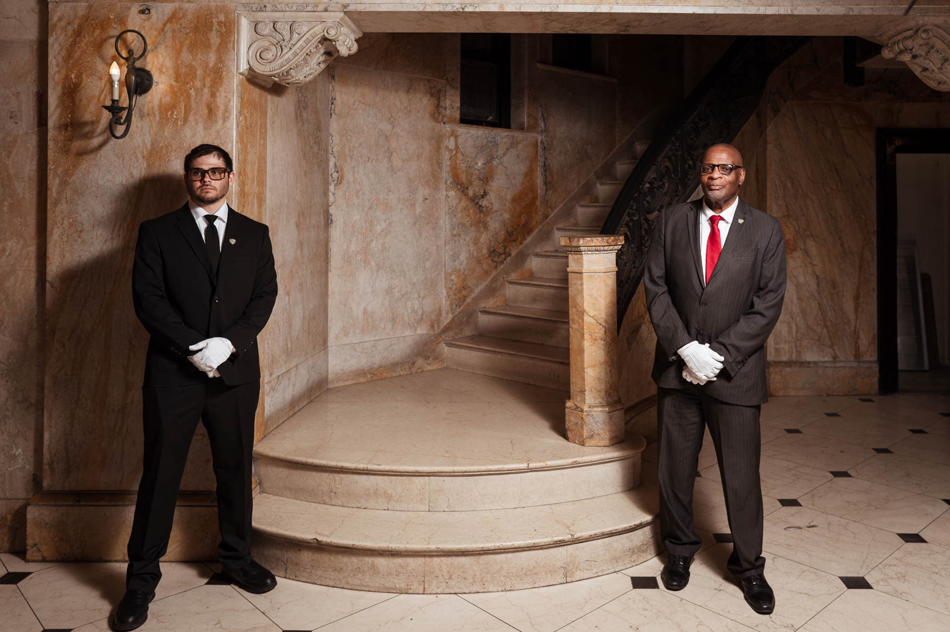 Image of Security USA® white glove attendants standing in residential building lobby.