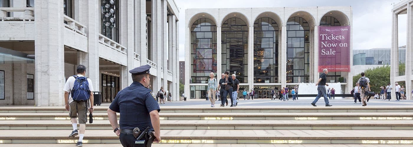 Security guard standing in a public square