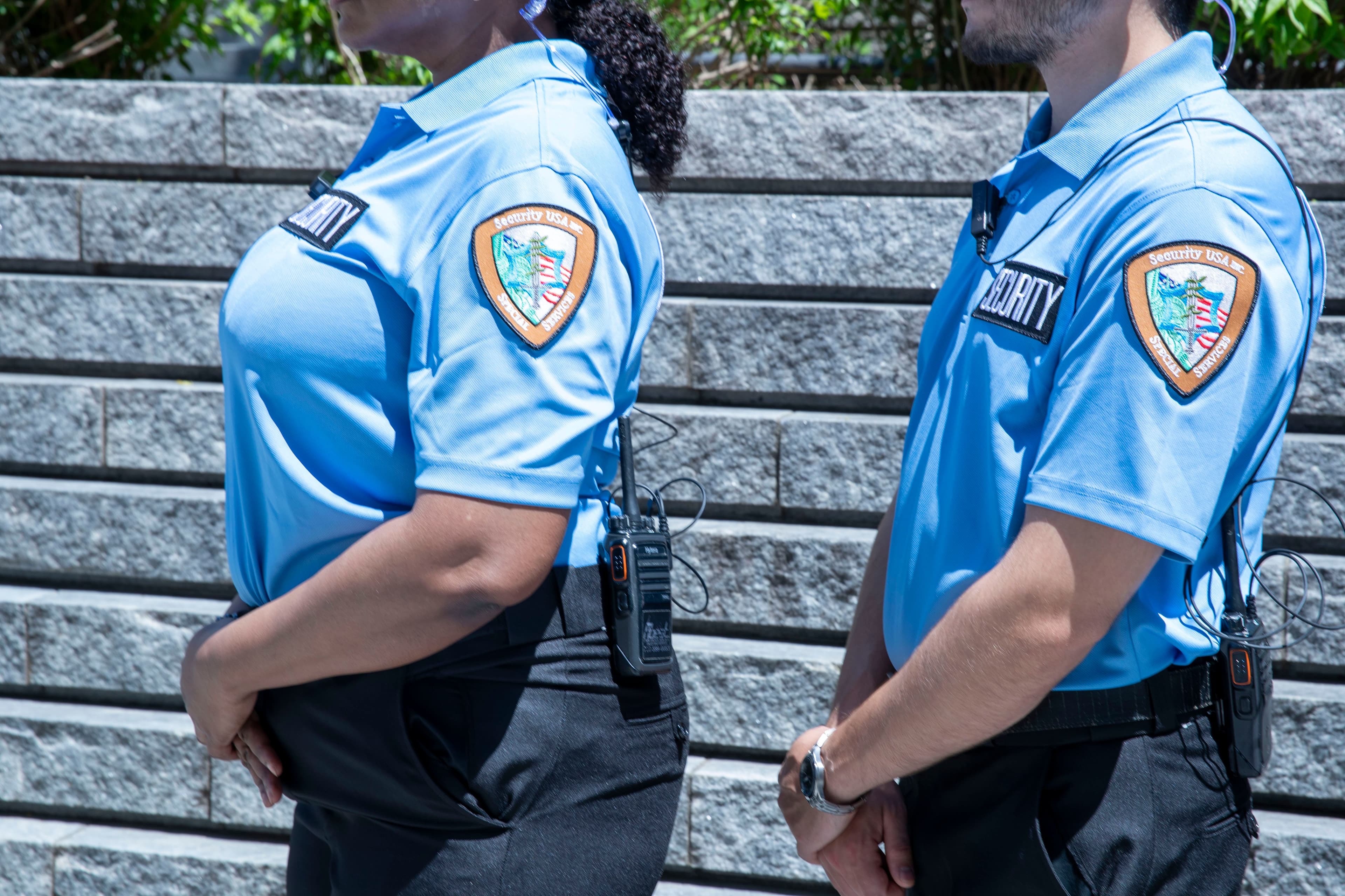 Image of Security USA® guards standing in company uniforms. 