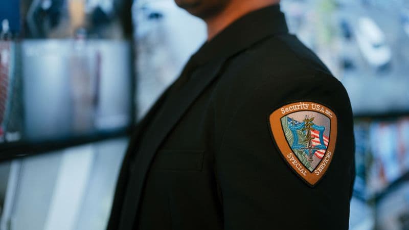 Image of guard with company logo.