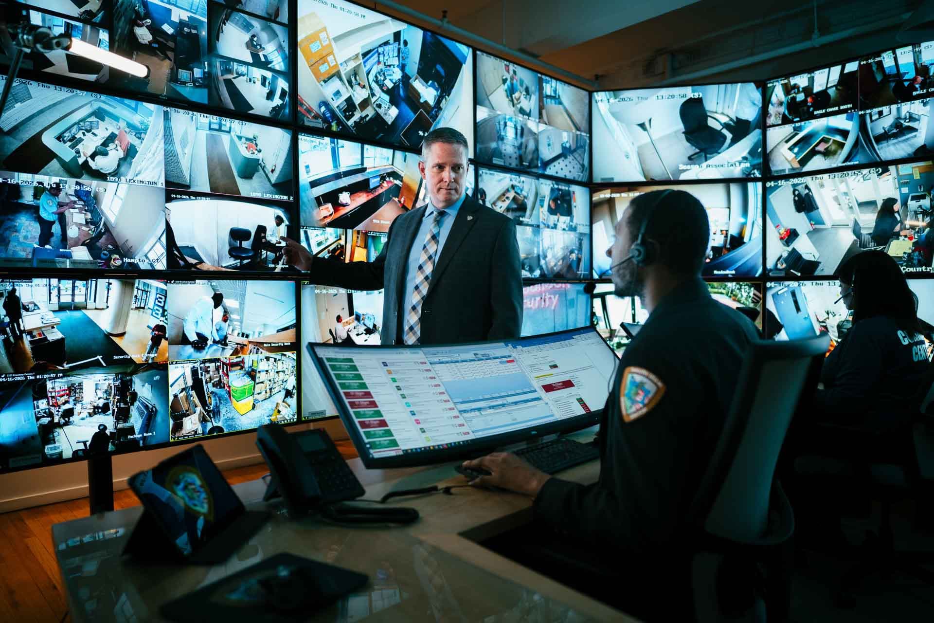 Security leadership monitoring operations from a command center