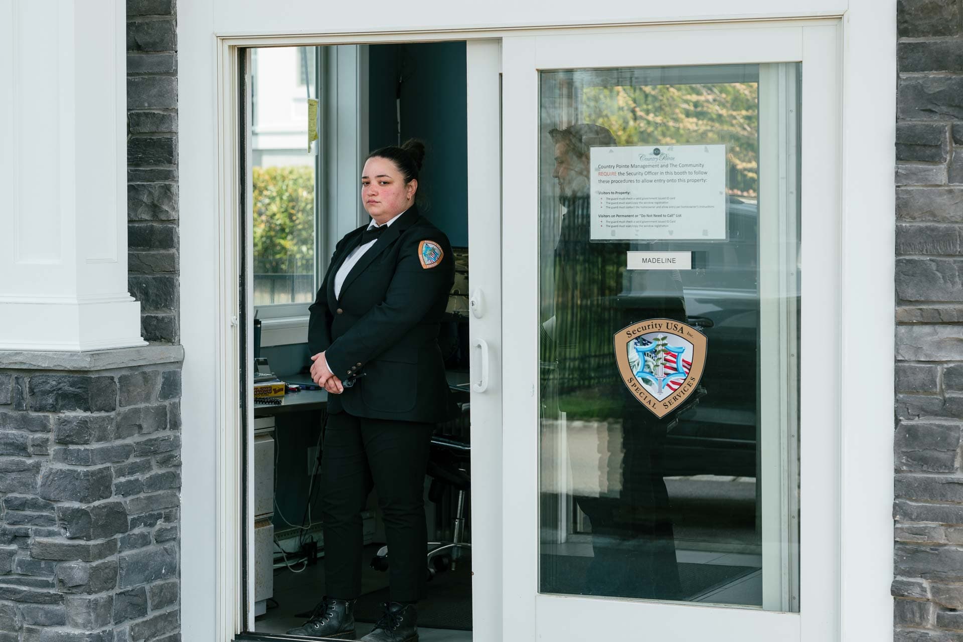 Image of Security USA® gated community guard house attended in front gate guard house.