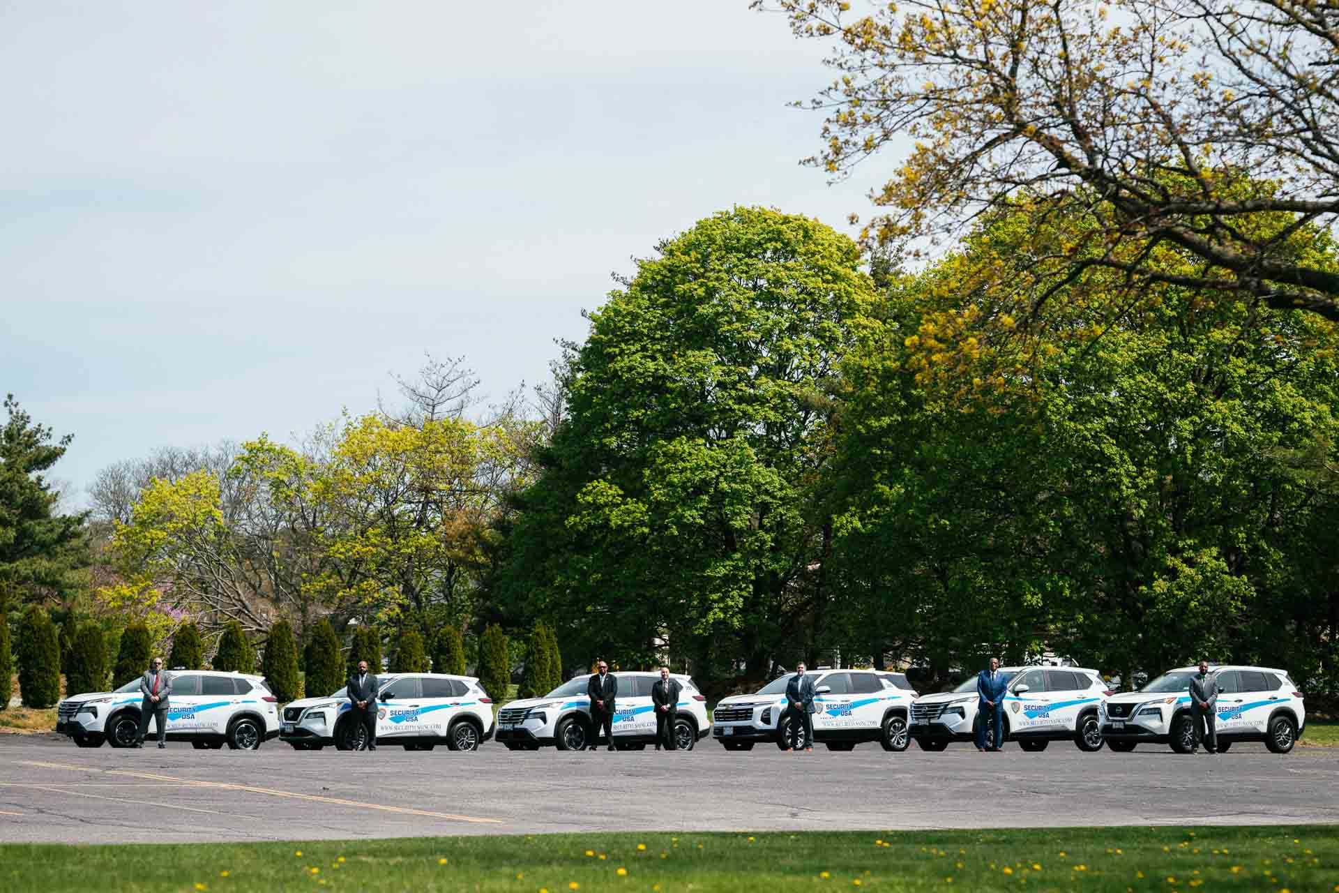 Company security vehicles with uniformed personnel on site