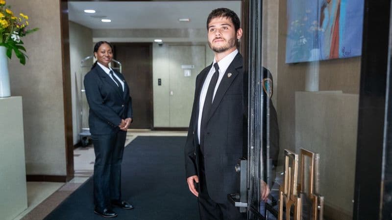 Image of a Security USA® doorman and concierge attendant at a luxury building entrance.