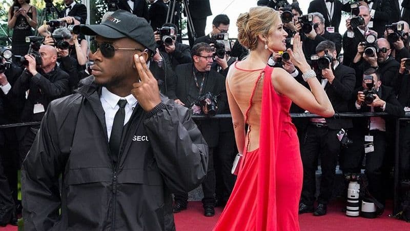 Image of an executive protection agent at a red carpet event.