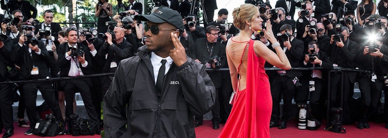 Image of an executive protection agent at a red carpet event.