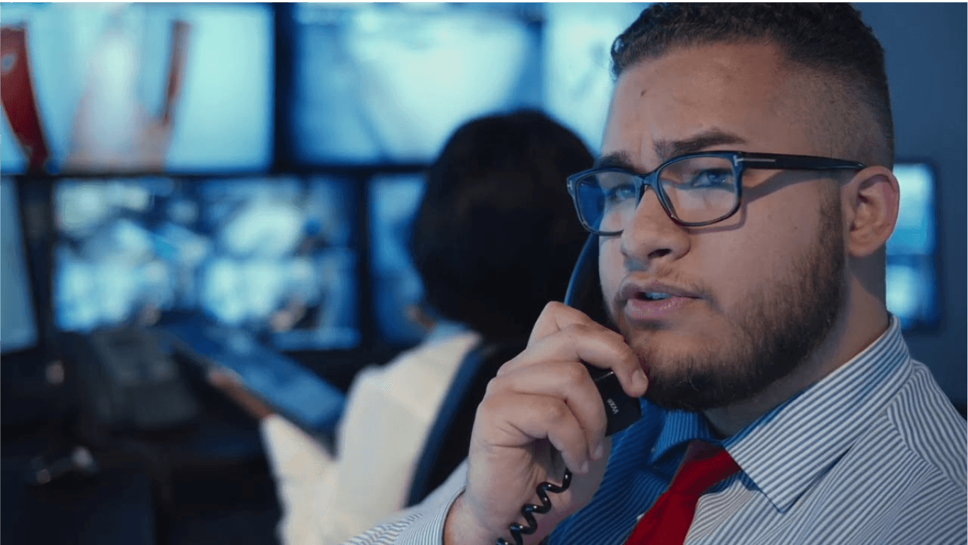 Image of a security guard in a command center.