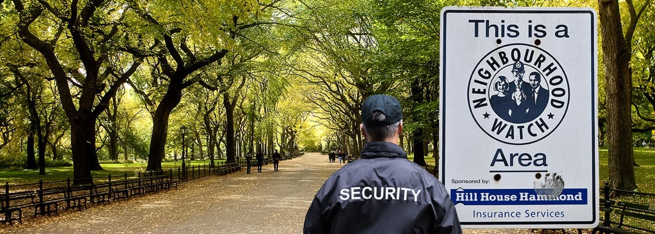 Image of Neighborhood watch security guard patrolling a city park.