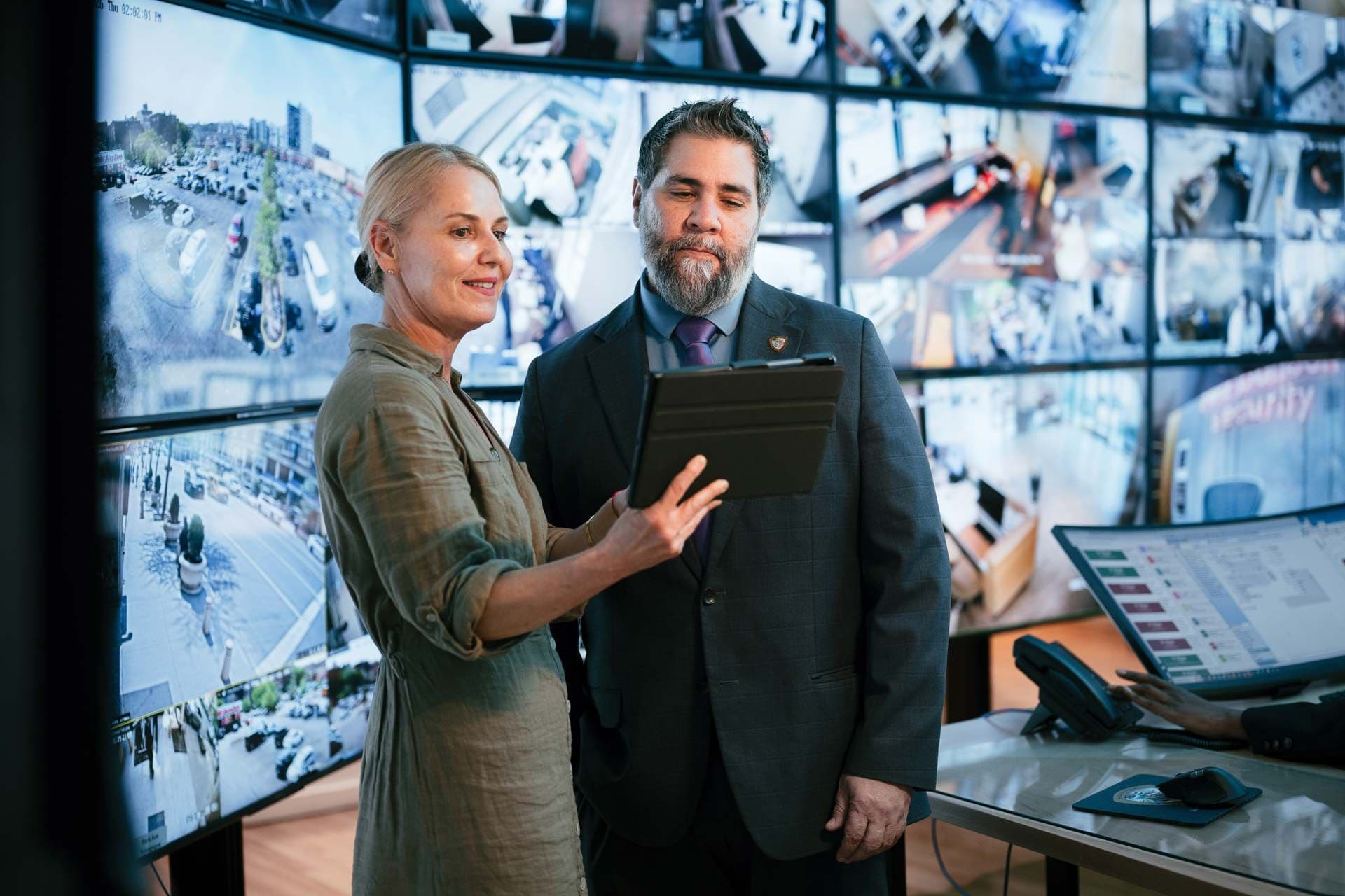 Image of property manager reviewing real time security reporting dashboard and analytics.
