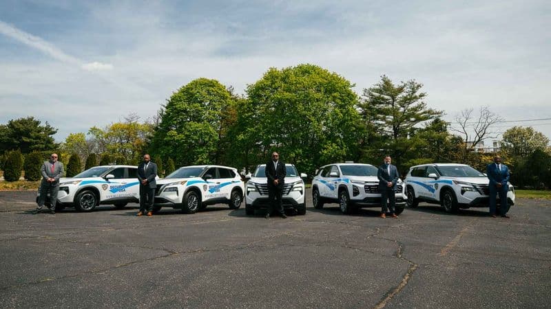 Image of Security USA® security guards at an event with company vehicles.