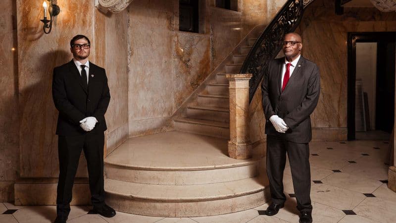 Security USA® white-glove team stationed at a luxury residential property entrance