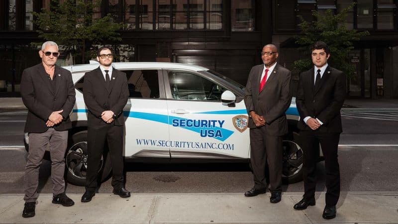 Image of Security USA® guards greeting visitor.
