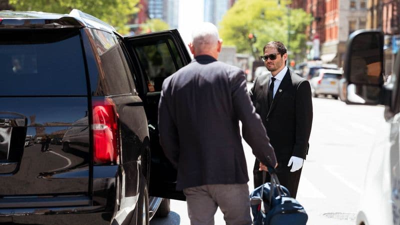 Image of a Security USA® valet attendant assisting resident into their vehicle.