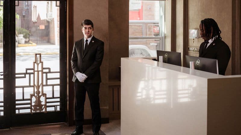 Image of white glove service with concierge in a residential building.