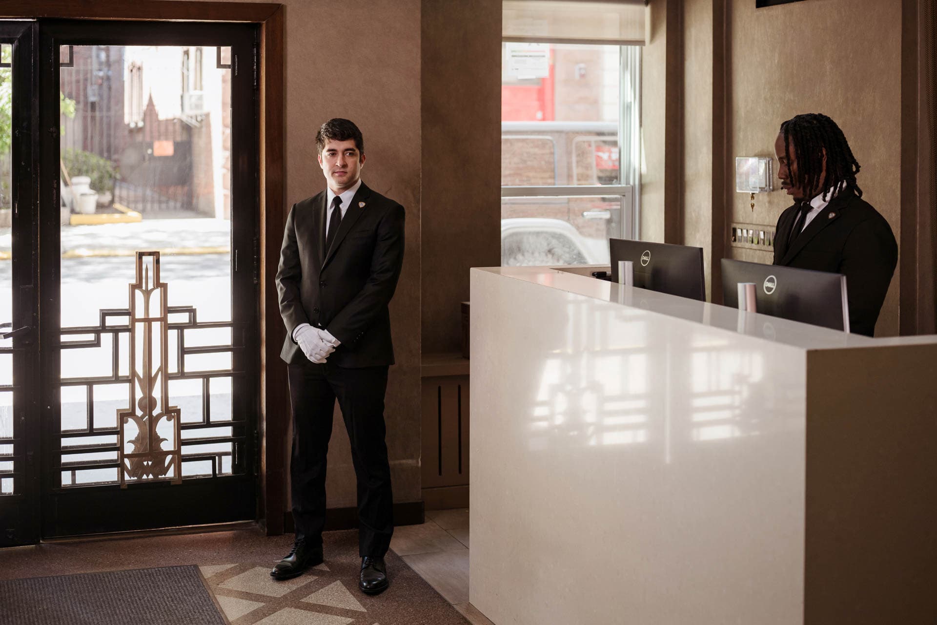 Image of white glove service with concierge in a residential building.